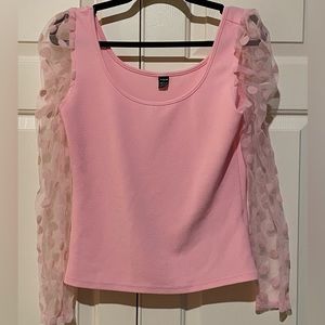 Pink top with sheer polkadot sleeves